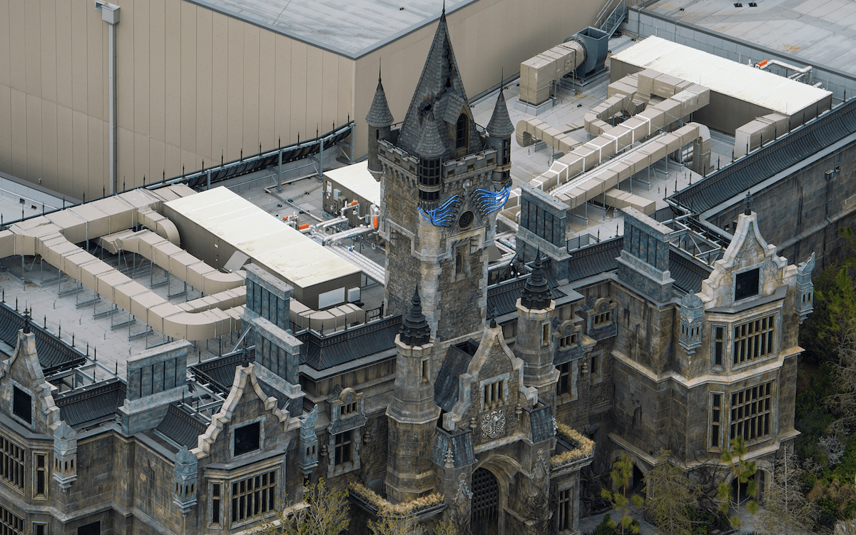 Frankenstein Manor with blue electricity lights on the tower, Epic Universe