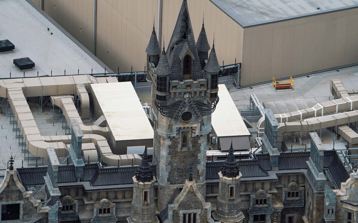 Zoomed out Frankenstein Manor tower with electricity lights off, Epic Universe